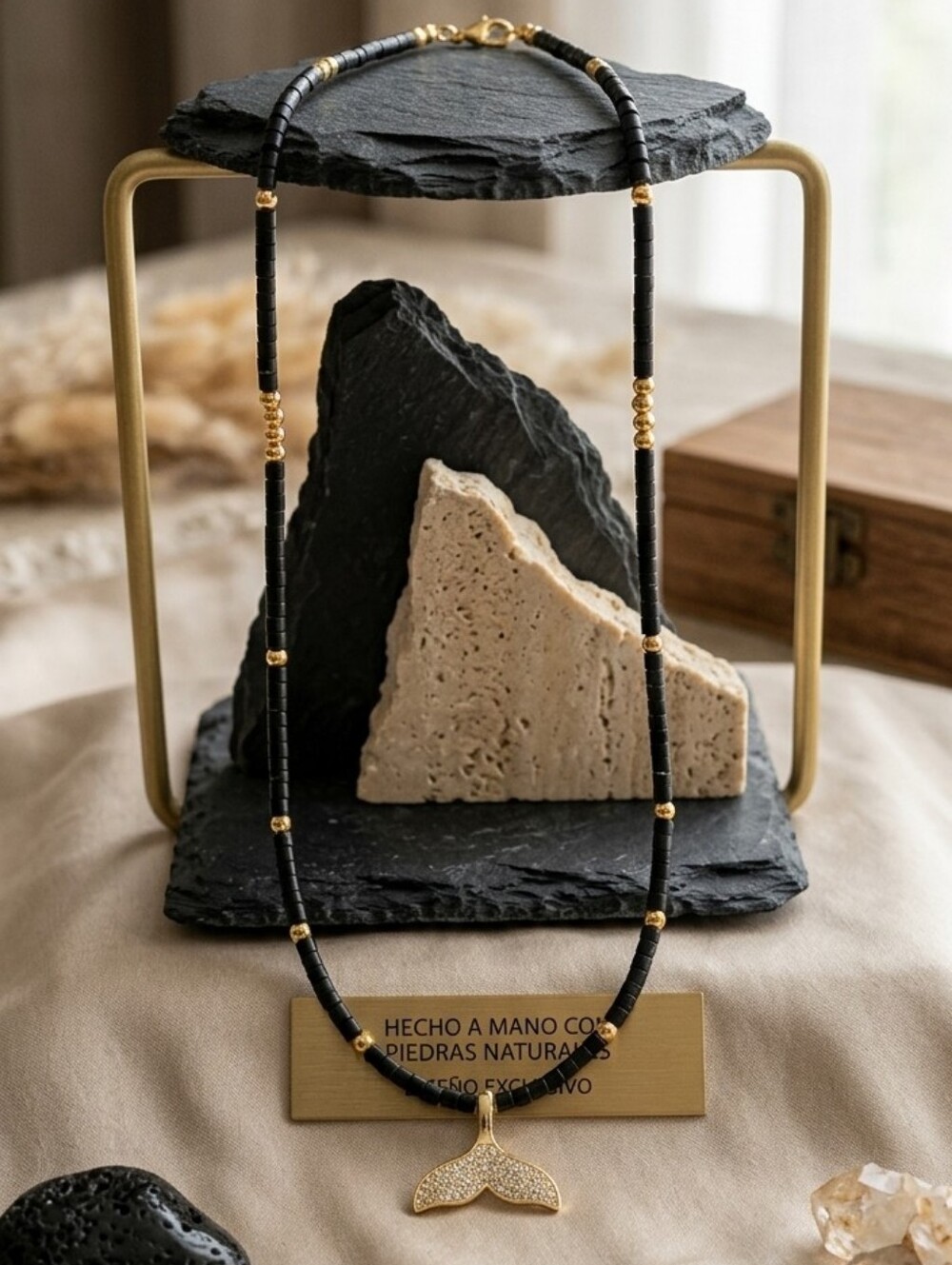 Elegant Black and Gold Necklace with Whale Tail Pendant